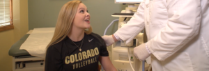 College female receiving Sports Medicine care at Colorado Family Orthopaedics with Dr. Garramone