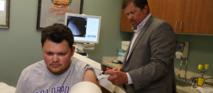 Male patient receiving Stem Cell Injection Therapy - Colorado Family Orthopaedics by Dr. Garramone
